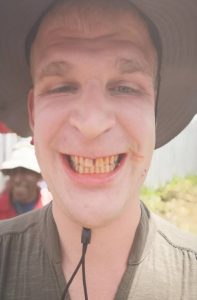 Pier having a red papua smile after chewing betelnut in Papua New Guinea