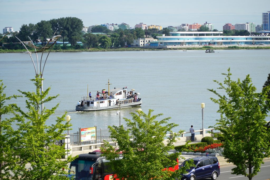 A chinese tour boat takes in the view from North Korea