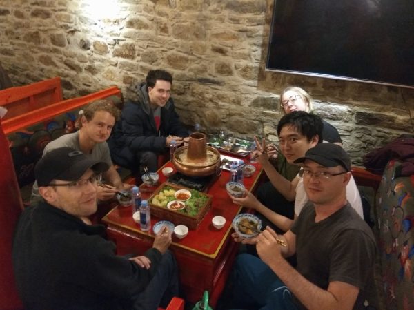 Our group eats Tibetan cuisine in the form of Tibetan hotpot