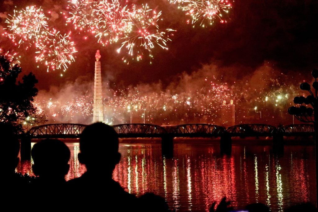 Fireworks about the Taedong river with a view of the Juche Tower