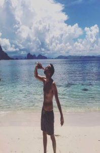 Man drinking beer in Palawan Island