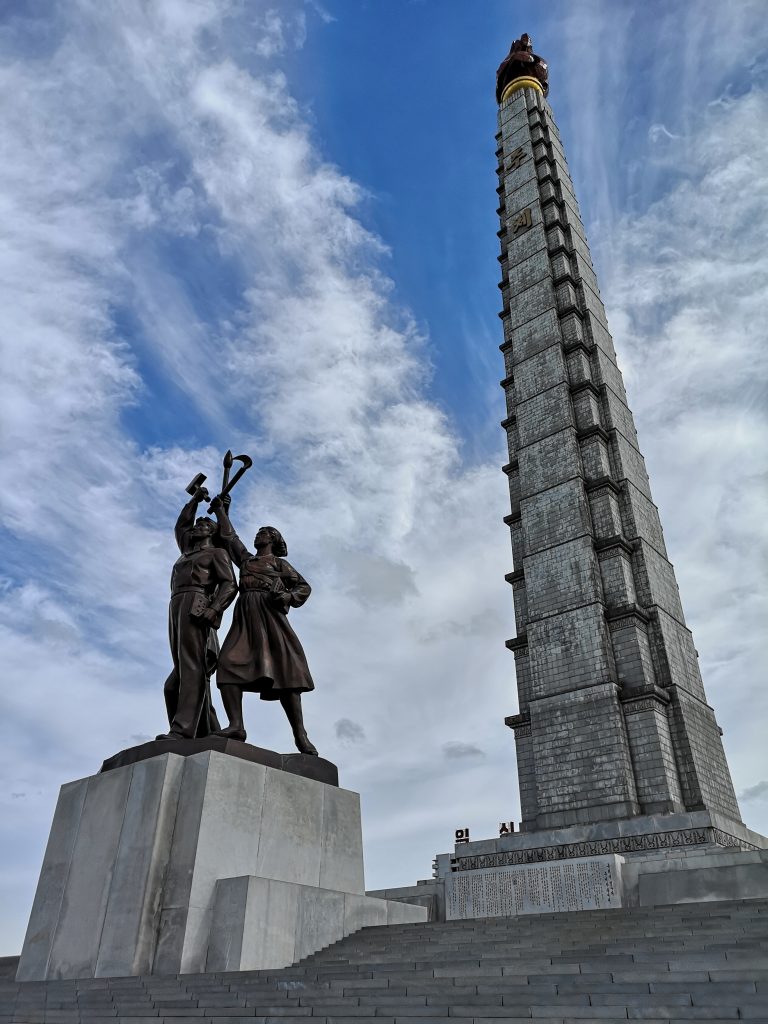 The Workers' Party monument at the foot of the Juche Tower, Pyongyang. Juche is key to answering the question "Is North Korea communist" 
