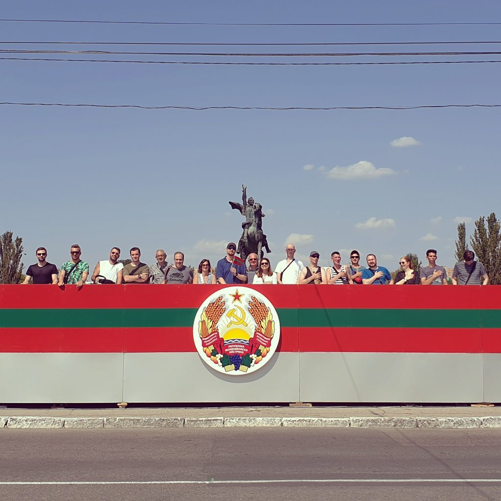 Our group standing on the Presidential stage during the National Day parade of Transnistria in Tiraspol