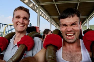 YPT guides Matt and Rowan on a rollercoaster in North Korea.