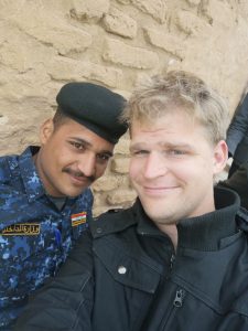 Two men taking photos in Iraq