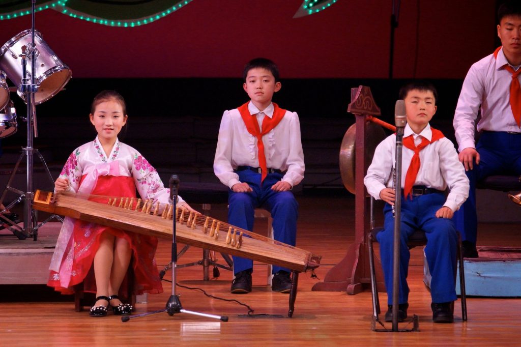 Children playing Kayagum, a traditional Korean instruments