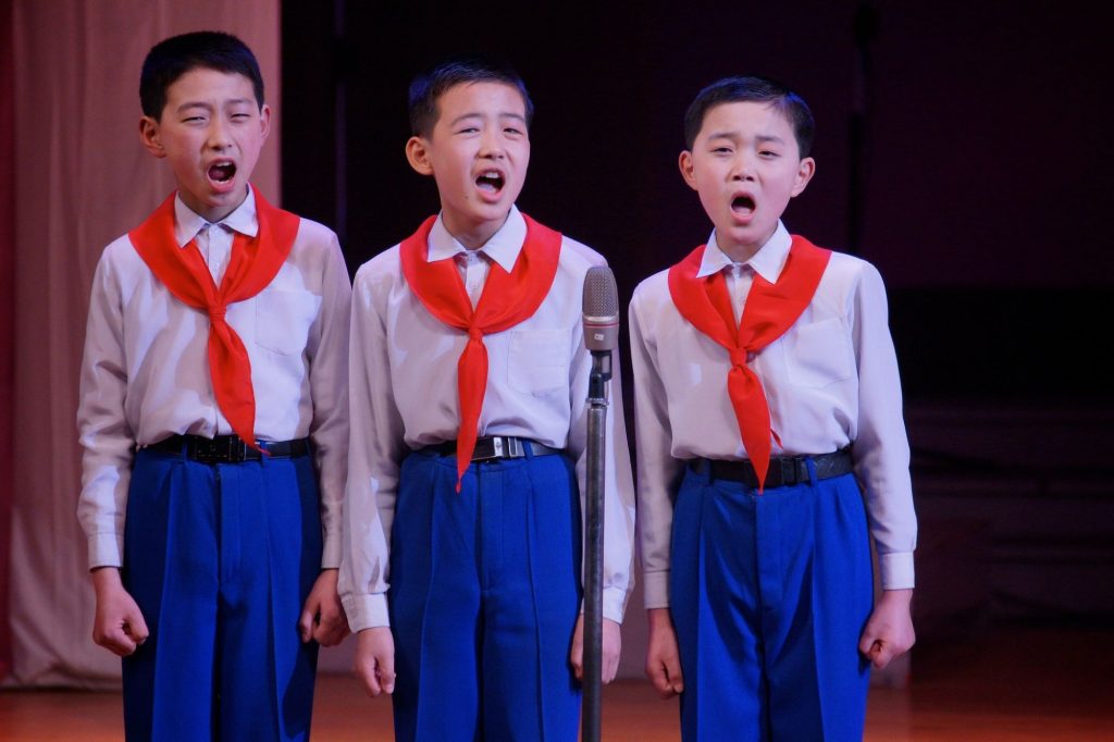 North Korean schoolboys singing during a performance at the Mangyongdae School