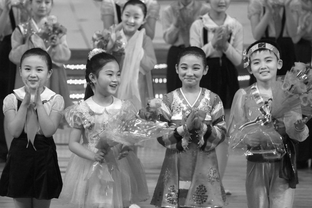 North Korean children being applauded