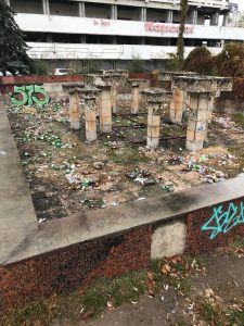 Abandoned building foundations strewn with garbage in Chisinau, Moldova.