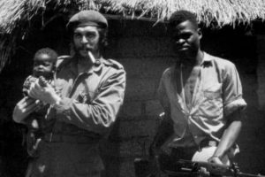 Che Guevara holding a baby in Zaire, later to become the DRC. 