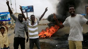 Sudan coup: young men protesting in Khartoum