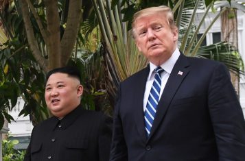 Trump kim walking side by side