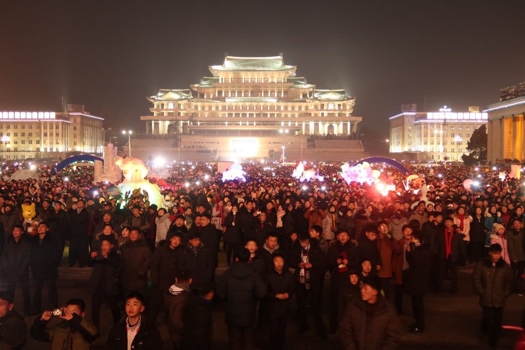 masses watching fireworks in Pyongyang