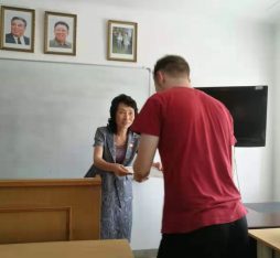 A student receiving his certificate on his Pyongyang Korean Language Study Tour