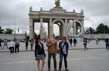 Pioneers pose in front of the entrance to Moscow's VDNKh.