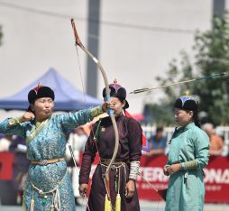 Mongolian archery: an archer looses an arrow at the Ulaanbaatar naadam.