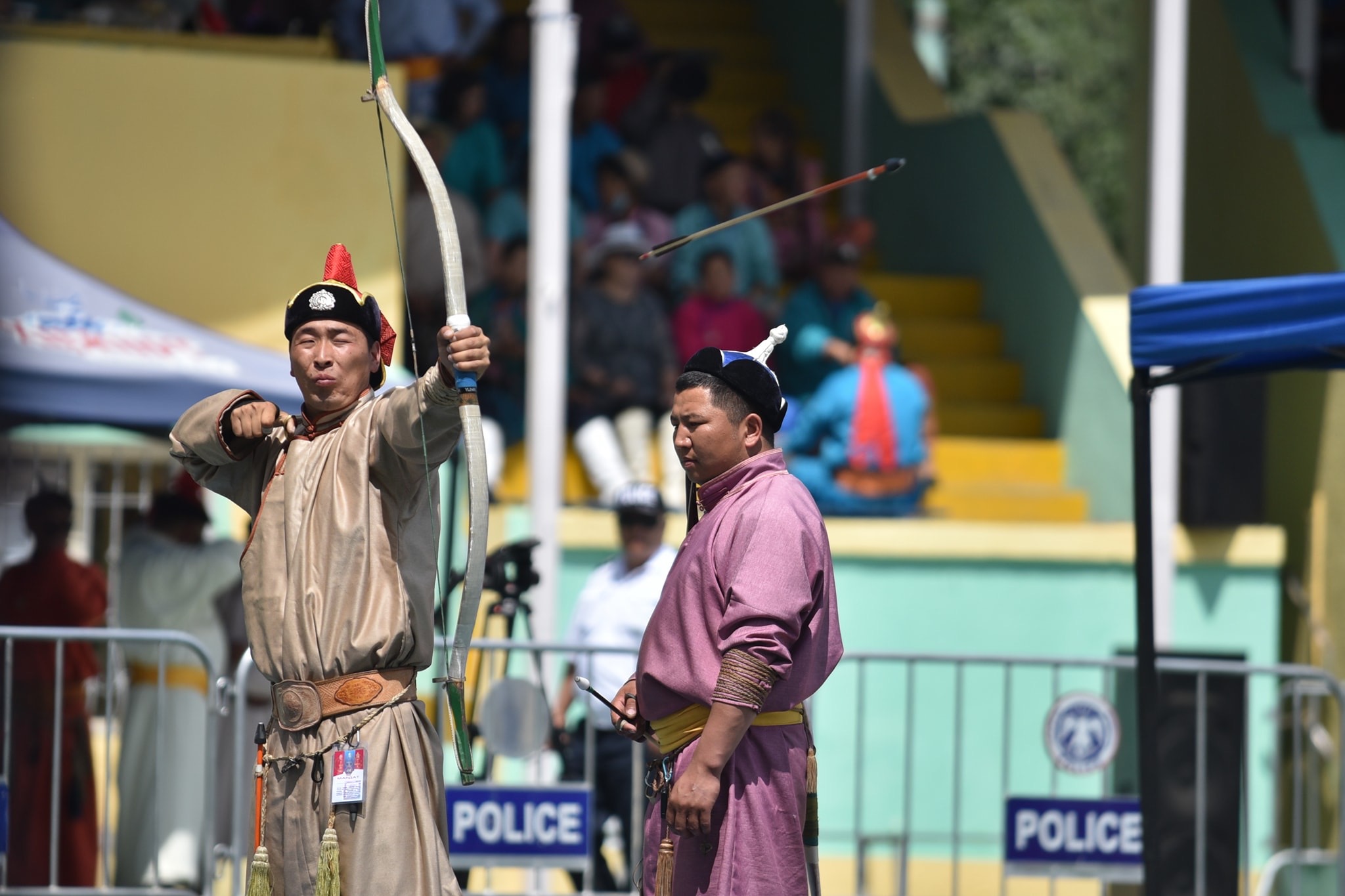 Mongolian Archery: an archer looses an arrow at the Ulaanbaatar archery competition. 