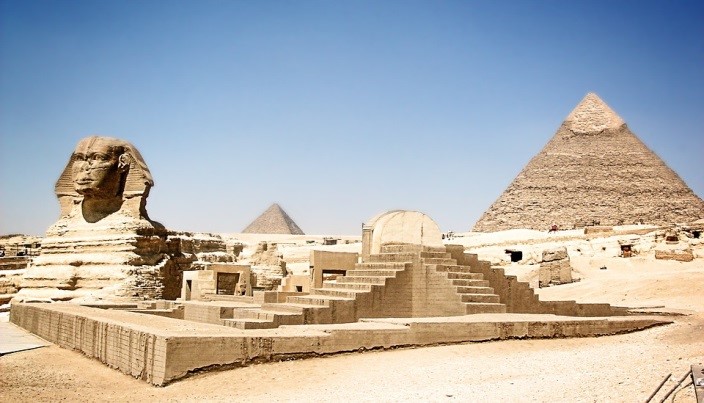 The Pyramids of Giza loom behind the Sphinx. 