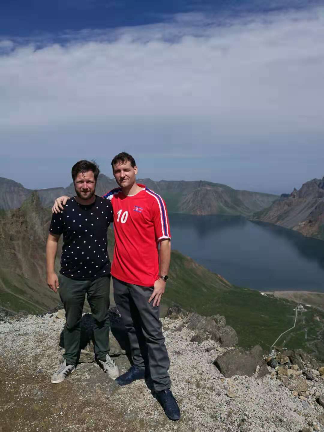 YPT Troy and Rik taking a photo by the top of Heaven's Lake, on Mt. Peakdu during the Korean Study Tour