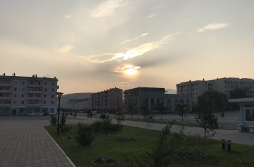 The sun sets over Rason, North Korea.
