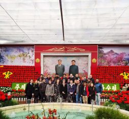 Our group standing in front of a mural of the leaders of the DPRK