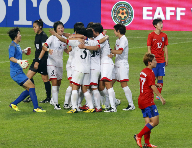 The North Korean women's squad celebrates their victory over South Korea. 