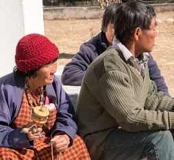 People holding prayer wheels in Bhutan