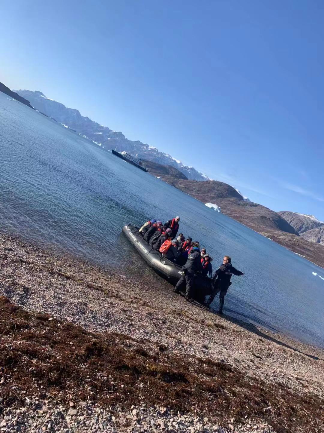 Our Zodiac boat boards a gravelly beach on Greenland. 