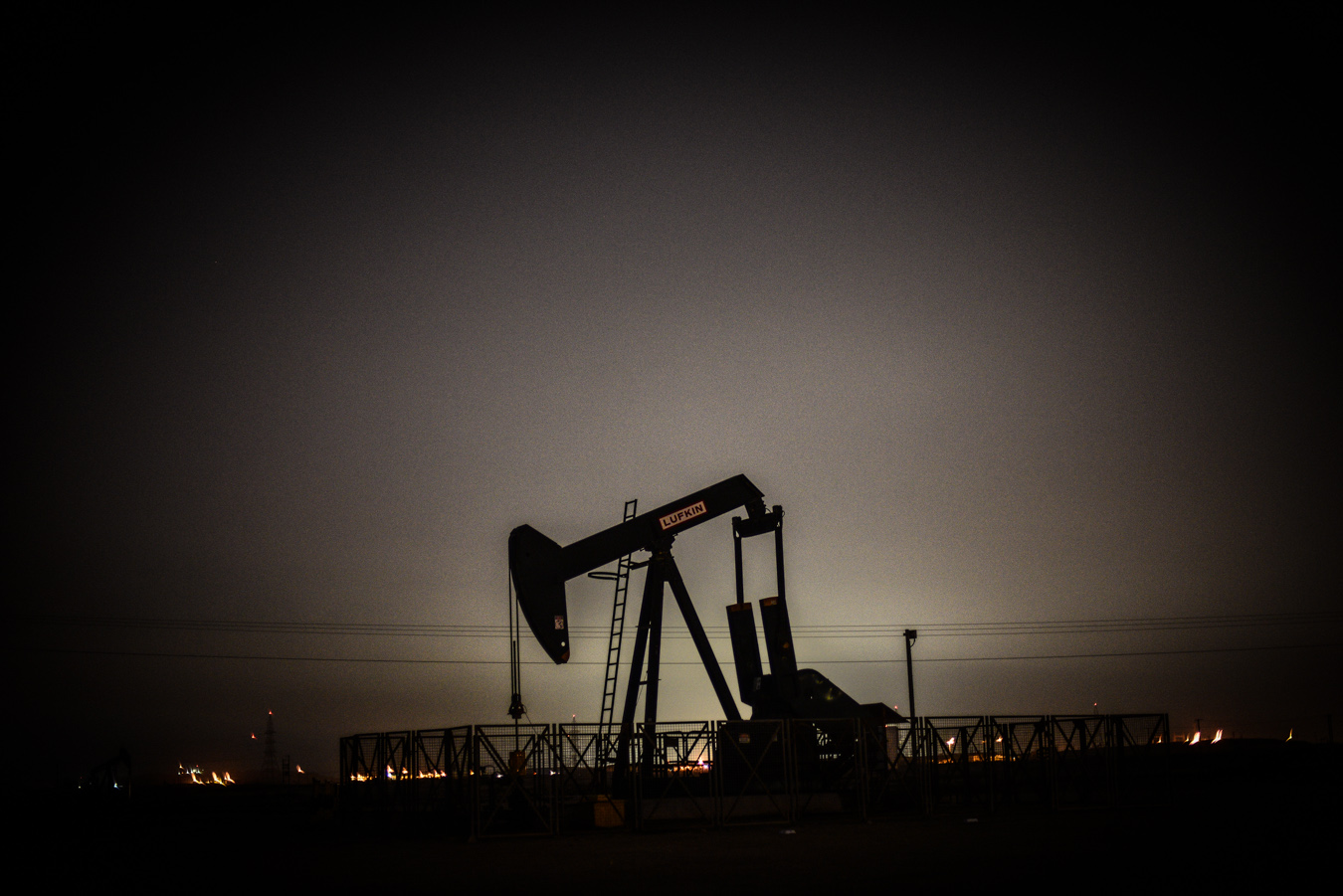 An oil rig at night, in Bahrain