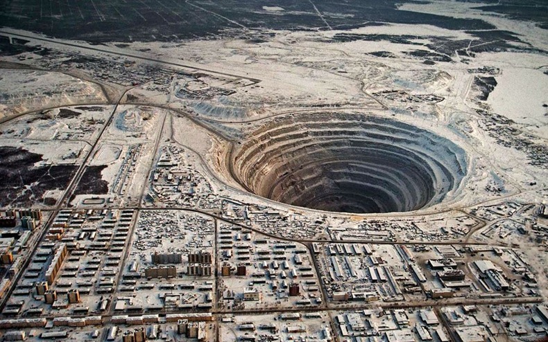 An aerial shot of the huge black hole of Mirny mine in Mirny, Yakutia, Siberia. 