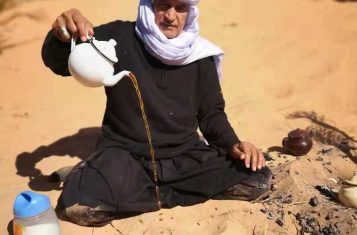 A nomad serves tea in the Algerian Desert near Taghit