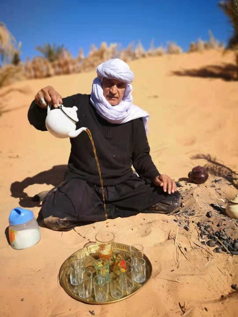 A nomad serves tea in the Algerian Desert near Taghit
