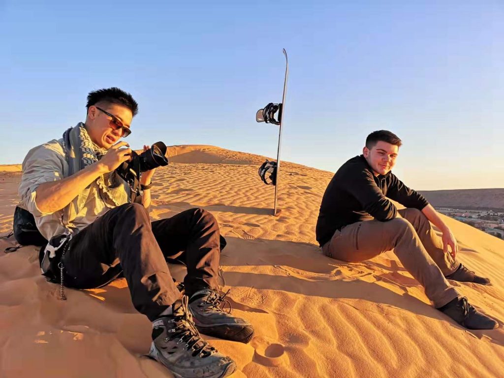 Sandboarding by the dunes of Taghit, in Algeria
