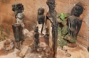 Different statues of voodoo gods