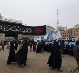 A procession taking place in front of Imam Husayn's Shrine, in Karbala