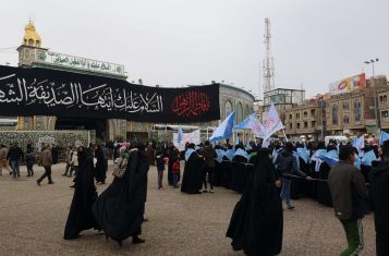 A procession taking place in front of Imam Husayn's Shrine, in Karbala