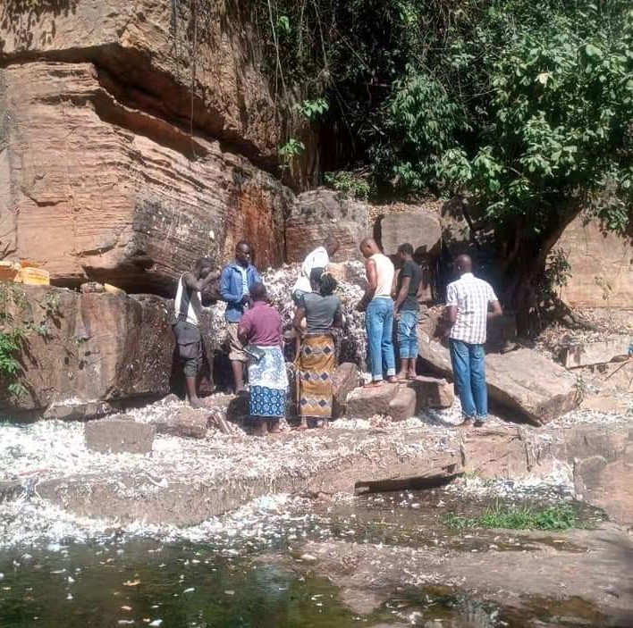 Locals at the sacrificial animist altar of Dafra, Burkina Faso