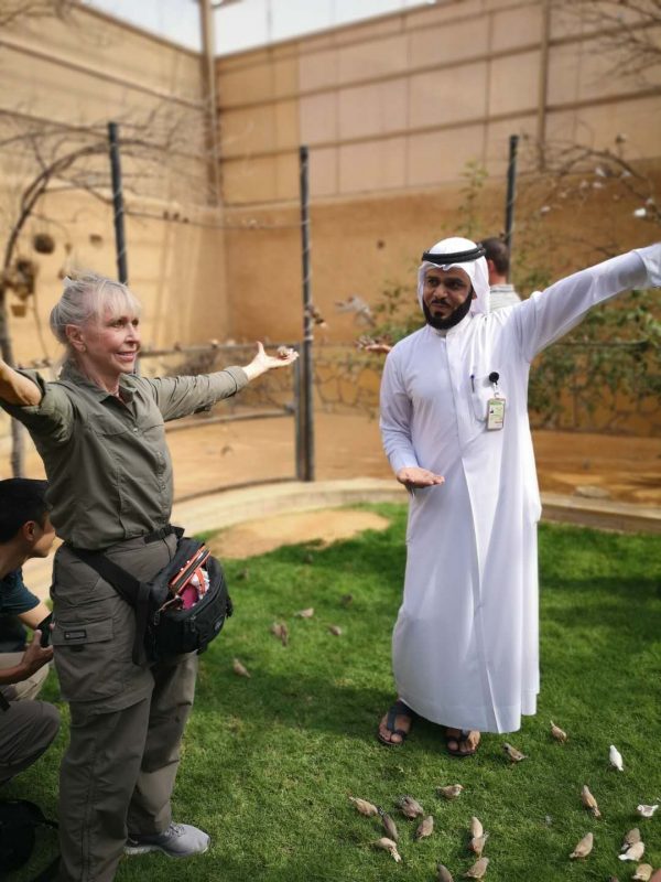 A YPT female tourist in Saudi Arabia interacts with a local guide