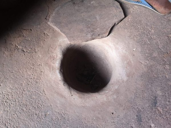 Mortar and pestle hole in a tata-somba, in Benin