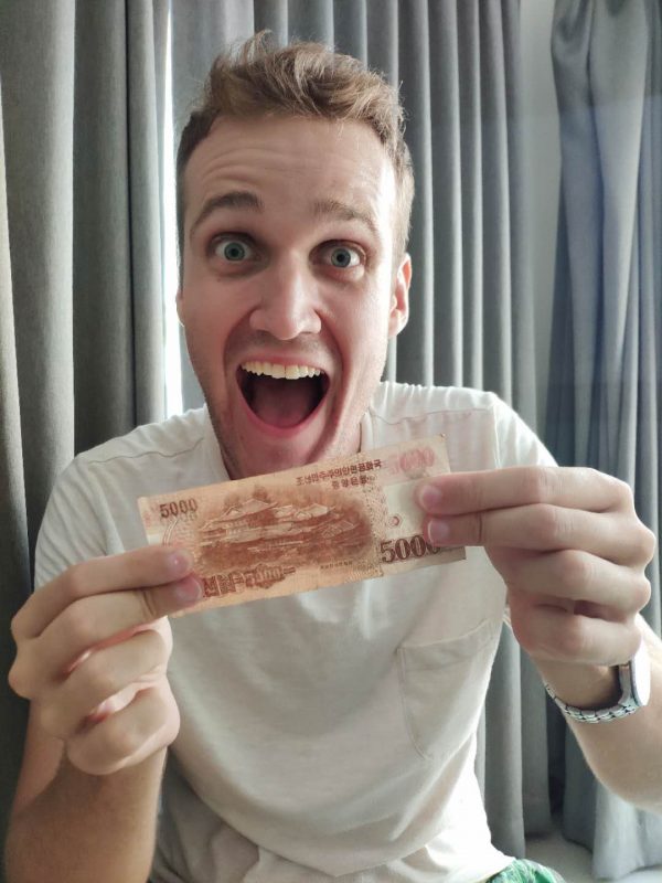 Rowan holding the new 5000 won north korean bill