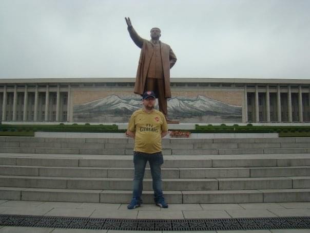 Gareth Johnson in front of the statue of Kim Il Sung on his first tour of North Korea