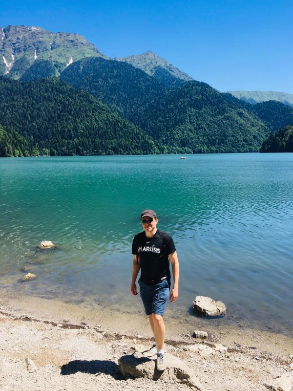 YPT guest David Stone standing by lake Ritsa while visiting Abkhazia