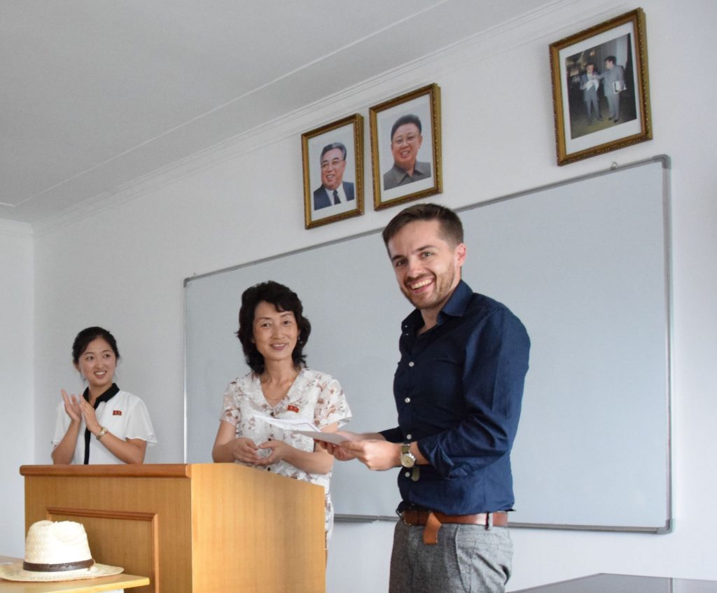 Simon with his teacher as he was studying in North Korea