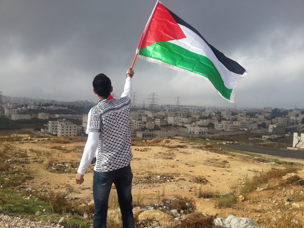 Man with a Palestinian flag