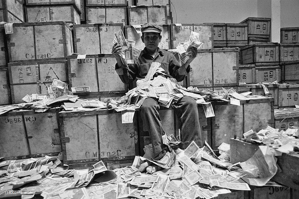 Khmer Rouge with captured old bank notes in Democratic Kampuchea