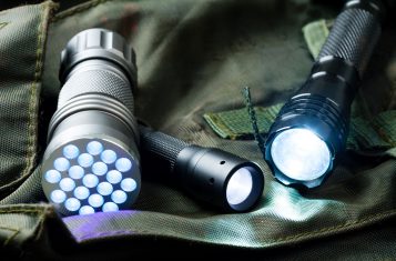 3 Flashlights over a bag