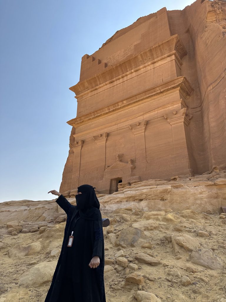Female tour guide at Hegra, saudi arabia