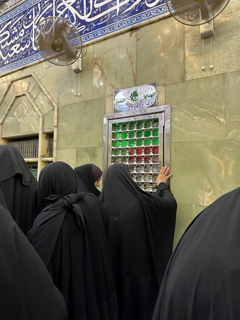 Pilgrims pray at Karbala