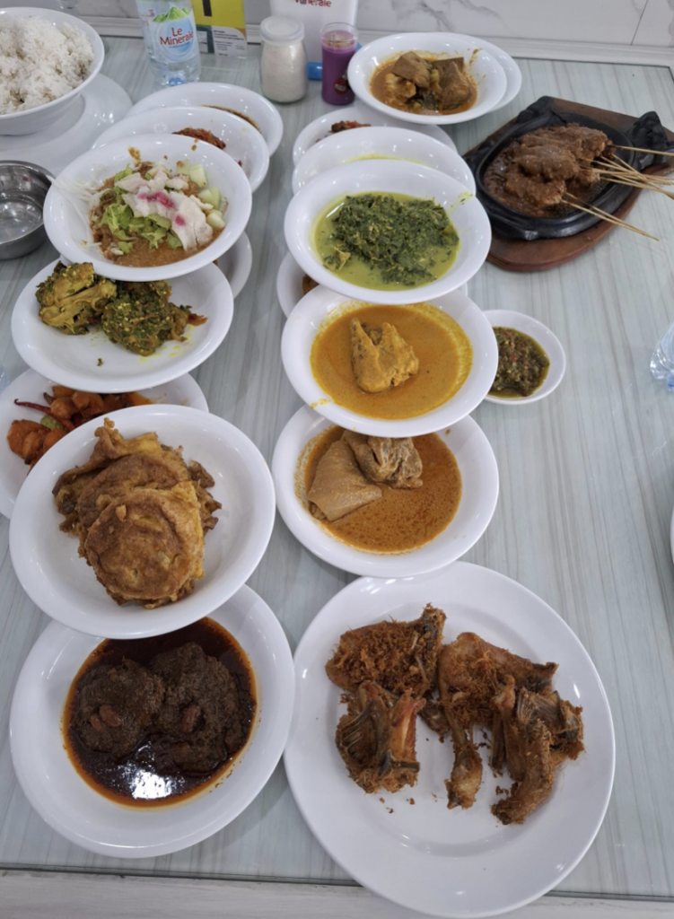 Padang food is the cuisine of the Minangkabau people of West Sumatra. All the above pre-cooked dishes were placed on dining table allowing two customers to choose what they want to eat with their rice.