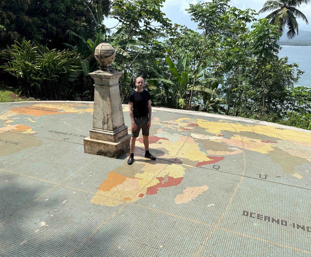 Author Marko Peck at the equator monument in São Tomé and Príncipe